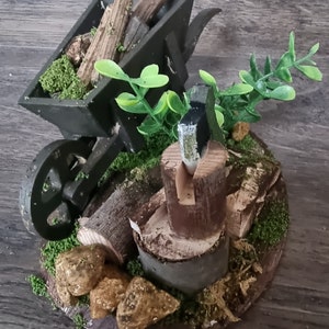 Dolls house miniature &#39;Chop Chop&#39; An unloved Wooden Barrow full of chopped wood on a weathered and rustic stone based. Axe. Moss. Plants