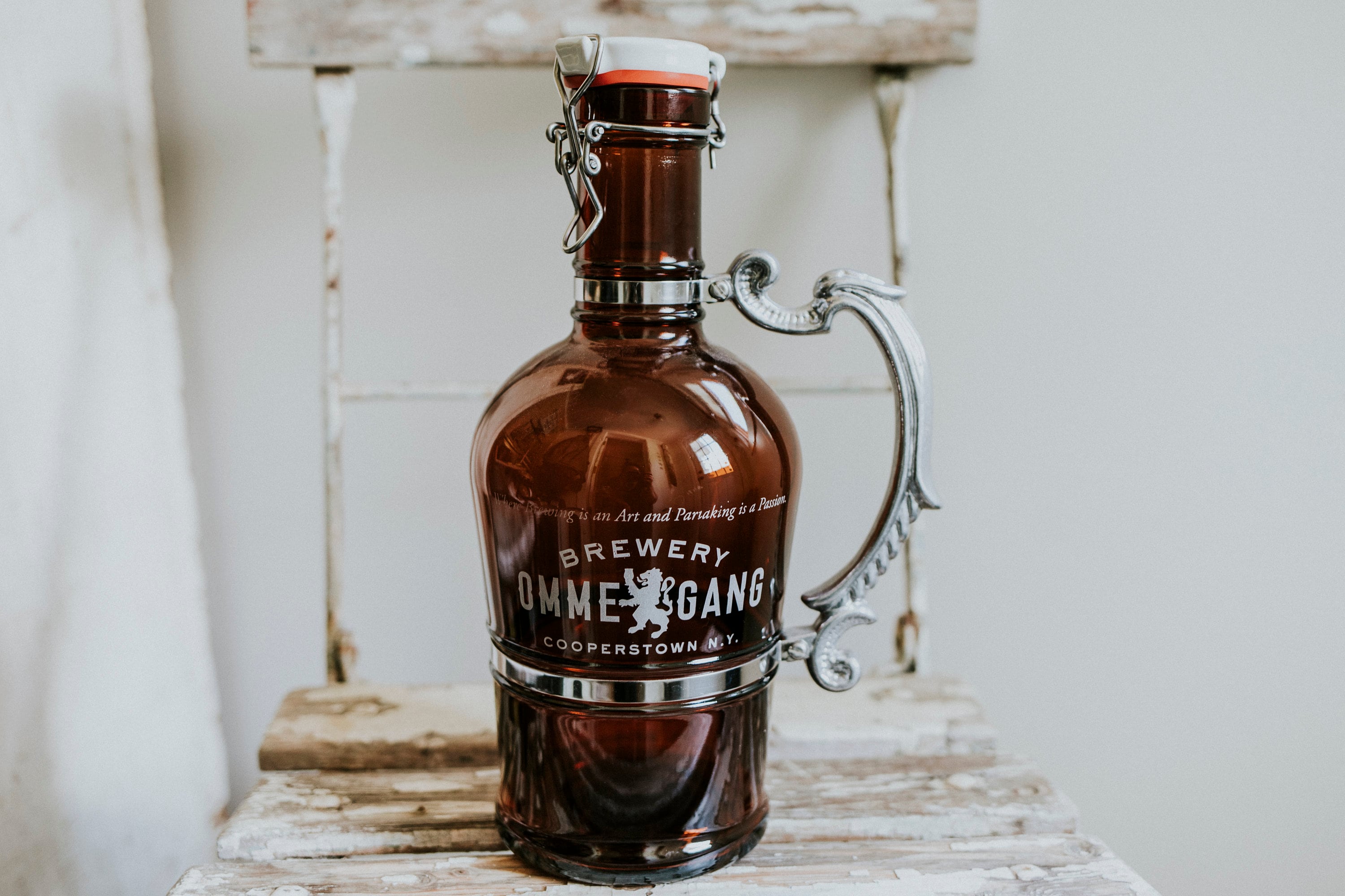 Ommegang Brewery Amber Glass Growler With Pewter Handle and