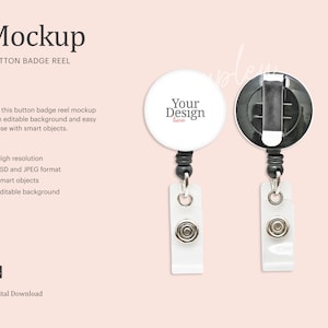 May include: White button badge reel mockup with a black retractable cord and a clip. The badge has a white background with the text "Your Design here".