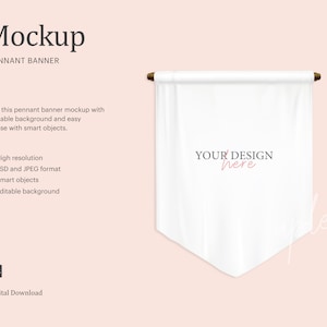 May include: A white pennant banner mockup with a wooden dowel at the top and bottom. The banner is hanging against a light pink background. The text "YOUR DESIGN here" is printed in pink on the banner.