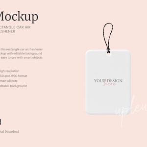 May include: A white rectangular car air freshener mockup with a black string for hanging. The text "YOUR DESIGN here" is printed on the front. The image also includes the text "Mockup" and "RECTANGLE CAR AIR FRESHENER".