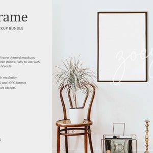 May include: A brown wooden chair with a white plant in a white pot on a small table. A black framed picture hangs on a white wall behind the chair. The picture is blank and ready for your design.