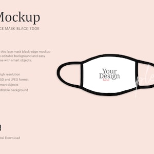 May include: A white face mask mockup with a black edge. The mask has the text "Your Design here" printed on it. The mask is isolated on a light pink background.