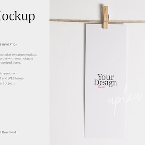 May include: A mockup of a ticket invitation template with the text "Your Design here" in the centre. The template is hanging from a string with a wooden clothes peg. The text "Ticket Invitation" and a description of the mockup's features are visible on the left side of the image.