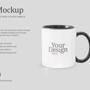 May include: White 11 ounce mug with a black handle and rim. The mug has the text "Your Design here" printed on the front.