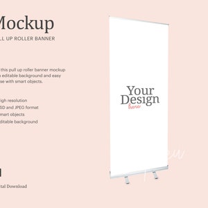 May include: A white pull-up roller banner mockup with the text "Your Design here" in black and pink. The banner is on a light pink background. The text "Mockup" and "PULL UP ROLLER BANNER" are at the top.