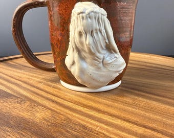 Wheel thrown copper mug with alabaster veiled lady bust