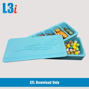 May include: A light blue game organizer with a feather design on the lid. The organizer has multiple compartments filled with game pieces in various colors and shapes. The text "L3i" is in the upper left corner, and "STL Download Only" is at the bottom.