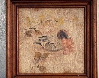 Vintage decorated and framed tile, measures 19x19 cm