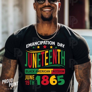 May include: Black t-shirt with a graphic design that says "Emancipation Day Juneteenth Black American Freedom June 19th 1865". The graphic is in red, yellow, and green.