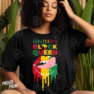 May include: Black t-shirt with the text "Juneteenth Black Queen" in yellow and red letters. A red, yellow, and green dripping lip with a pink tongue is below the text. The lip has a small green outline and a small yellow star on the tongue.