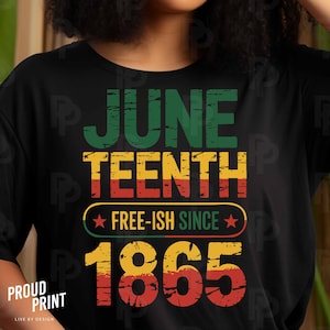 May include: Black t-shirt with a vintage-style graphic that says "Juneteenth Free-ish Since 1865" in red, yellow, and green.