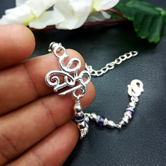 Hem Jewels® Silver Rakhi for Brother | Ganesh & Shivling | Spiritual  Bracelet