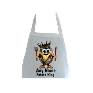 May include: White kitchen apron featuring a cartoon potato wearing a crown and holding a fork and knife. The text "Any Name Potato King" is printed below the potato.