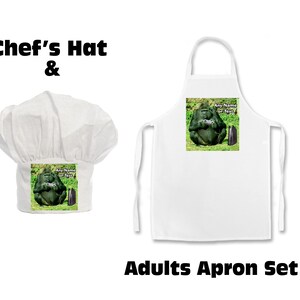 May include: A white chef's hat and apron set. The apron and hat feature a graphic of a gorilla playing a video game. The text "Any Name or Text" is on the graphic. The words "Chef's Hat &" and "Adults Apron Set" are also visible.