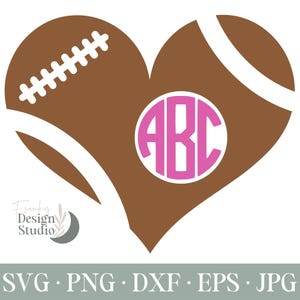 Puede incluir: Un balón de fútbol de color marrón en forma de corazón con costuras blancas y un contorno blanco. El corazón tiene un círculo rosa en el centro con las letras "ABC" en blanco.