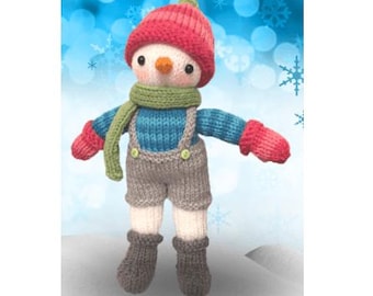 May include: A knitted snowman doll wearing a red hat, blue and white striped sweater, gray overalls, green scarf, and red mittens. The doll is standing on a white surface with a blue and white snowflake background.