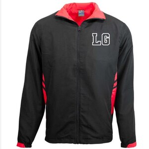 May include: Black zip-up jacket with red detailing and lining. The jacket displays the white letters "LG" on the chest. The collar and side panels are red, and it has a full zip.
