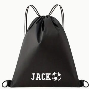 May include: Black drawstring bag with white text that says "JACK" and a white football graphic.