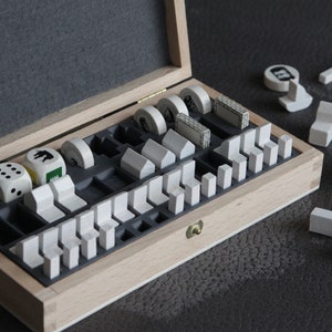 Organizer holder tray suitable for the Settlers wooden game pieces of Seafarers and Cities and Knights