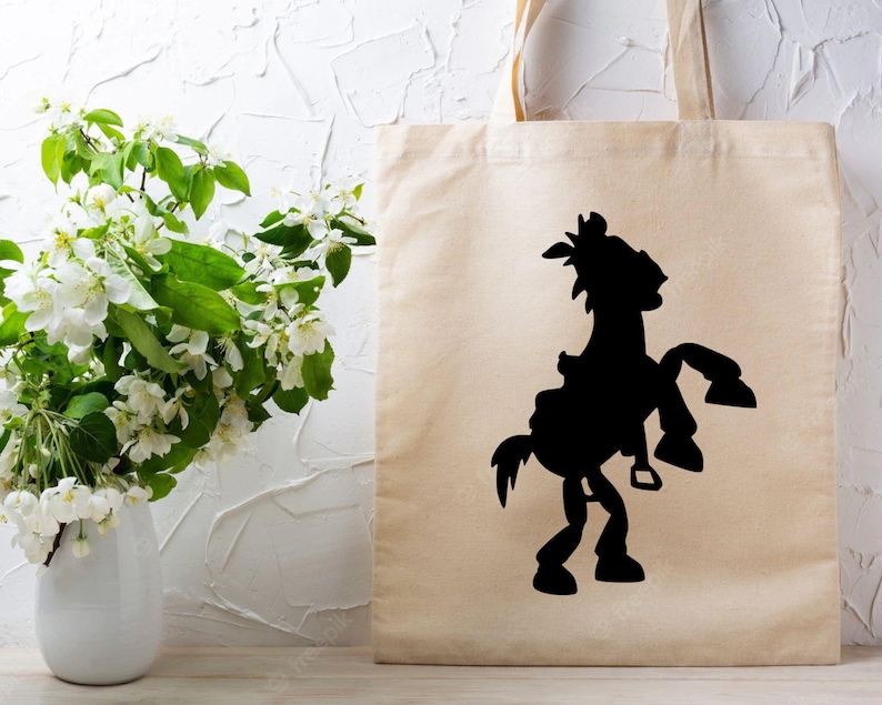 May include: A beige tote bag with a black silhouette of a horse and rider. The horse is rearing up on its hind legs.