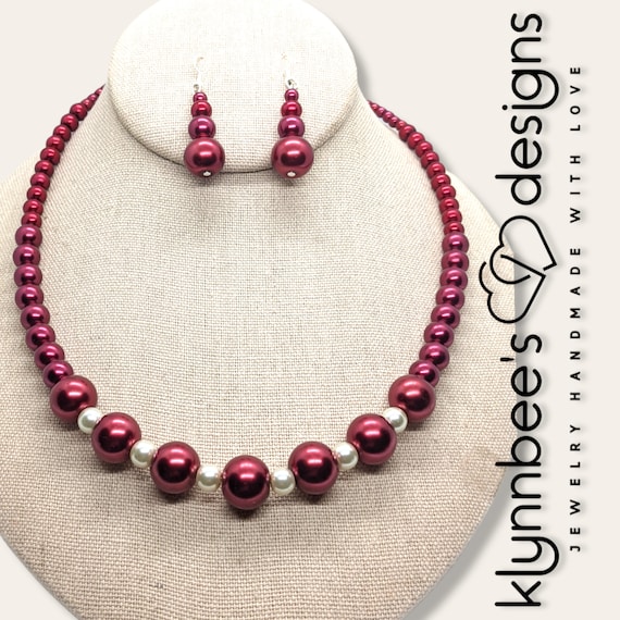 Red and white pearl best sale necklace