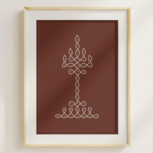 May include: A framed print featuring a symmetrical white design on a dark red background. The design resembles a stylized candelabra or floral motif. The print is encased in a light-colored wooden frame, suitable for wall decor.