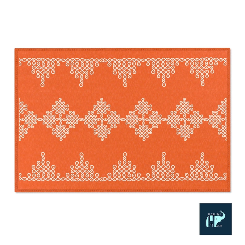 May include: Orange rug with a white geometric pattern. The pattern is made up of repeating knots and swirls. The rug has a stitched border.