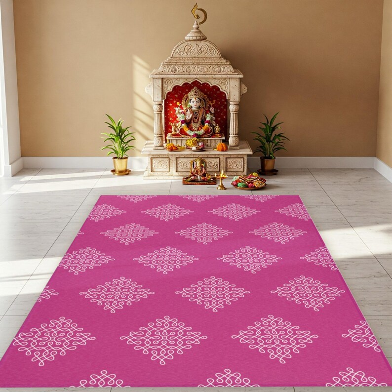 May include: A pink prayer rug with a white geometric pattern. The rug is in front of a small, ornate shrine with a statue of a deity.