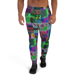 May include: Black athletic pants with a colorful geometric pattern featuring squares and rectangles in shades of pink, blue, green, yellow, and white.