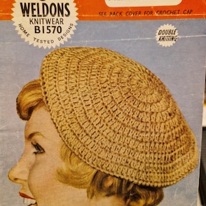 May include: A close-up of a woman wearing a crocheted beret. The beret is a light brown color and is made with a double knitting stitch. The pattern is called "Weldons Knitwear B1570" and is for a crochet beret. The text "6d" is visible on the pattern.