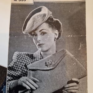 May include: A vintage knitting pattern leaflet for a beret and bag. The leaflet is titled "Weldons Beret and Bag" and has the number 335. The leaflet shows a woman wearing a beret and holding a bag. The text on the leaflet says "10 ozs. of Yarn for Set (Under 100 yards to the oz.)"