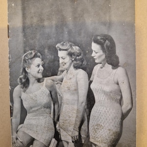 May include: Vintage black and white image of three women modeling knitted swimsuits. The image is from a pattern booklet titled "LADIES' VESTS (Summer Weight)" with the text "PATONS BEEHIVE FINGERING, 2-PLY".