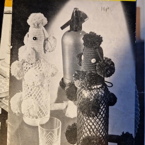 May include: A vintage crochet pattern booklet for making party bottle covers. The cover features a black and white photo of two crocheted bottle covers shaped like poodles, one white and one black. The text on the cover reads "COATS Party Bottle Covers Leaflet 931 LD CROCHETED IN ANCHOR PEARL COTTON No. 5 16P".