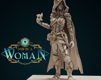 May include: A detailed white and gold figurine of a female character from a fantasy role-playing game. The figure is wearing armor, a hooded cloak, and holding a mask. The text "DND IS A WOMAN" is displayed in a stylized logo.