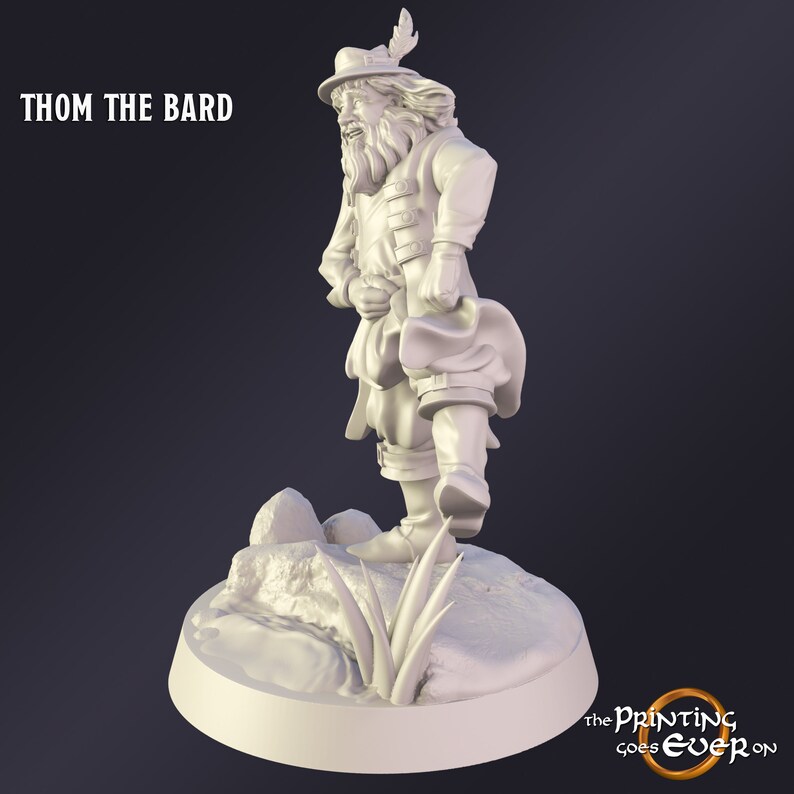 May include: A 3D-printed figurine of Thom the Bard, a character with a hat, feather, and period clothing. The figure stands on a small, rocky base with grass. The text "THOM THE BARD" is at the top left.