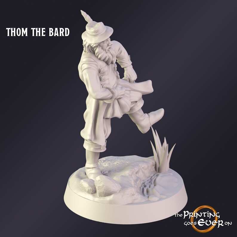 May include: A white figurine of Thom the Bard, a character in a historical costume, stepping on a rock. The figure wears a hat with a feather, a long coat, and ruffled pants. The text "THOM THE BARD" is at the top left.