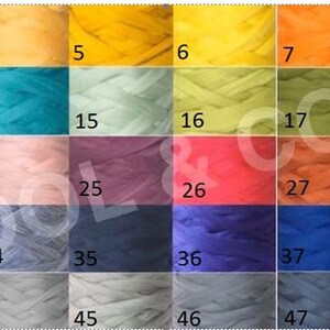 May include: A color chart of 50 different shades of yarn. The yarn is arranged in rows of 10, with each row numbered 1-50. The colors range from light to dark, and include shades of blue, green, red, orange, yellow, brown, gray, and white.