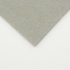 May include: A close-up of a sheet of grey textured paper.