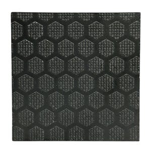 May include: A square, black, textured surface with a repeating honeycomb pattern. The pattern consists of hexagonal shapes with small, circular indentations. The surface appears to be made of a durable material.