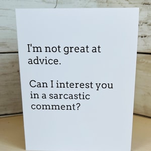 May include: White card with black text that reads "I'm not great at advice. Can I interest you in a sarcastic comment?"