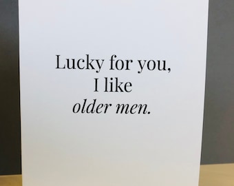 May include: White card with black text that reads "Lucky for you, I like older men."
