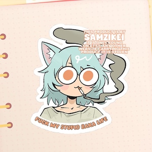 May include: A die-cut sticker featuring an anime-style character with light blue hair, cat ears, and large round eyes, smoking a cigarette. The text reads "FUCK MY STUPID BAKA LIFE" at the bottom and includes a watermark about the artist Samzikei.