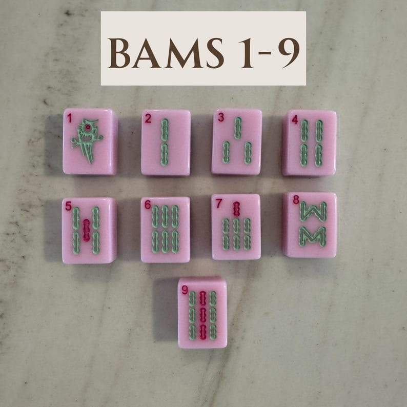 May include: Nine pink Mahjong tiles with green and red markings, numbered 1 through 9. The top of the image reads "BAMS 1-9". The tiles are arranged in a grid, showcasing the different symbols and numbers.