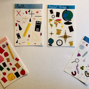 May include: Four colorful cards with different school subjects: Math, Social Studies, ELA, and Science. Each card has a variety of colorful stickers representing the subject.