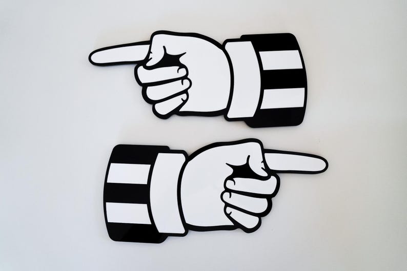 May include: Two black and white pointing hand signs. The hands are pointing to the right. The signs are made of a thick, durable material.