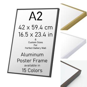 May include: An aluminum poster frame with text reading A2, 42 x 59.4 cm, 16.5 x 23.4 in, Custom Sizes For Perfect Gallery Wall, Aluminum Poster Frame available in 15 Colors. The frame is shown in black, gold, white, and dark brown finishes.