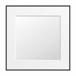 May include: Square black picture frame with a white mat. The frame has a thin black border and a white interior mat, creating a clean, modern aesthetic. The center is a blank white space.