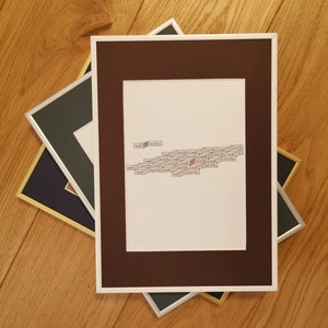 May include: A brown picture frame with a white mount and a white background. The background has the words "wall" and "bonito" repeated in a pattern.