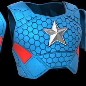 May include: A blue superhero costume chest piece with a silver star emblem. The costume features a honeycomb pattern and red accents. Includes separate shoulder and arm pieces. The design is reminiscent of a comic book character.